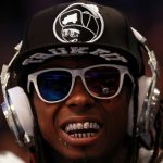 ORLANDO, FL - FEBRUARY 26:  Hip-hop artists Lil' Wayne, wearing diamond studded beats headphones by Dr. Dre sits courtside during the 2012 NBA All-Star Game at the Amway Center on February 26, 2012 in Orlando, Florida.  NOTE TO USER: User expressly acknowledges and agrees that, by downloading and or using this photograph, User is consenting to the terms and conditions of the Getty Images License Agreement.  (Photo by Ronald Martinez/Getty Images)